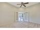 Room with French doors opening to a view of the living room at 19939 N Golden Barrel Dr, Surprise, AZ 85374