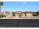 Single-story home with a two-car garage and nicely landscaped front yard at 19939 N Golden Barrel Dr, Surprise, AZ 85374