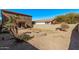 Landscaped backyard with fire pit and gravel at 20673 N Marquez Dr, Maricopa, AZ 85138