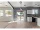 Kitchen with white cabinets, granite counters, and sliding door to backyard at 20673 N Marquez Dr, Maricopa, AZ 85138