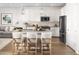 Modern kitchen with white cabinets and a kitchen island at 20739 N 223Rd Ave, Surprise, AZ 85387