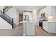 Modern kitchen with island, stainless steel appliances, and white cabinets at 21011 N 58Th Way, Phoenix, AZ 85054