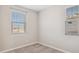 Well-lit bedroom with window blinds and neutral wall tones at 21016 N 58Th Way, Phoenix, AZ 85054