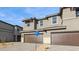 Attractive two-story home boasts a three car garage, stone veneer accents, and a stylish facade at 21016 N 58Th Way, Phoenix, AZ 85054