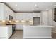 Modern kitchen with white cabinets, quartz countertops, and stainless steel appliances at 21016 N 58Th Way, Phoenix, AZ 85054