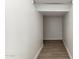 Additional storage closet with hanging rod and tile floor at 21023 N 58Th Way, Phoenix, AZ 85054