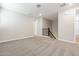 Spacious upstairs hallway with neutral carpeting and a modern metal railing at 21023 N 58Th Way, Phoenix, AZ 85054