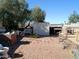 Backyard patio with storage shed and seating area at 211 W Kiser St, Superior, AZ 85173