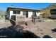 Home's backyard with a deck and patio area at 211 W Kiser St, Superior, AZ 85173