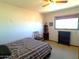 Bedroom with double bed, ceiling fan, and shelving at 211 W Kiser St, Superior, AZ 85173