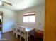 Small dining area with table and chairs near a doorway at 211 W Kiser St, Superior, AZ 85173