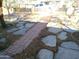 Front yard with flagstone and brick pathway at 211 W Kiser St, Superior, AZ 85173