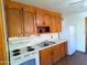 Simple kitchen with wood cabinets and appliances at 211 W Kiser St, Superior, AZ 85173