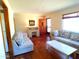 Living room with hardwood floors and comfy seating at 211 W Kiser St, Superior, AZ 85173