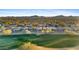 Community overview featuring homes and a golf course at 2164 W Muirfield Dr, Anthem, AZ 85086