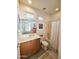 Cozy bathroom features a classic vanity, framed mirror, and a shower-tub combo with white shower curtain at 2164 W Muirfield Dr, Anthem, AZ 85086