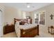 Charming bedroom with a wooden bed frame and window shutters at 2164 W Muirfield Dr, Anthem, AZ 85086