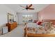 Main bedroom with king bed, dresser, and backyard view at 2164 W Muirfield Dr, Anthem, AZ 85086