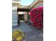 Entryway with walkway, bougainvillea, and view to front door at 2164 W Muirfield Dr, Anthem, AZ 85086