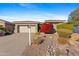 House exterior with landscaping, driveway and two car garage at 2164 W Muirfield Dr, Anthem, AZ 85086