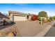 Single-story home with attached garage and landscaping at 2164 W Muirfield Dr, Anthem, AZ 85086