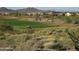 Golf course and homes nestled in desert landscape at 2164 W Muirfield Dr, Anthem, AZ 85086