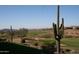 Scenic view of a golf course with desert landscape at 2164 W Muirfield Dr, Anthem, AZ 85086