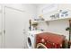 Convenient laundry room with washer, dryer, and storage shelves at 2164 W Muirfield Dr, Anthem, AZ 85086