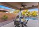 Covered patio with seating area, pool view, and mountain backdrop at 2164 W Muirfield Dr, Anthem, AZ 85086