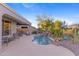 Private pool area with patio furniture and water feature at 2164 W Muirfield Dr, Anthem, AZ 85086