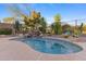 Relaxing kidney-shaped pool with a waterfall feature at 2164 W Muirfield Dr, Anthem, AZ 85086