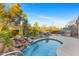 Refreshing kidney shaped pool and waterfall feature at 2164 W Muirfield Dr, Anthem, AZ 85086