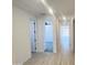 Hallway showcasing tile flooring and access to multiple rooms at 22311 W Monona Ln, Surprise, AZ 85387