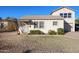 House exterior showcasing a spacious front yard and attached garage at 2232 N 13Th St, Phoenix, AZ 85006