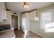 White cabinets and appliances in this eat-in kitchen at 2232 N 13Th St, Phoenix, AZ 85006