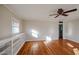 Bright living room with hardwood floors, built-in shelves, and ceiling fan at 2232 N 13Th St, Phoenix, AZ 85006