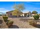 View of the backyard with gravel and desert landscaping at 22424 W La Pasada Blvd, Buckeye, AZ 85326