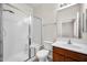 Bathroom with shower, toilet and brown vanity at 22424 W La Pasada Blvd, Buckeye, AZ 85326