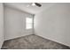 Spacious bedroom featuring a window with blinds and carpeted floor at 22424 W La Pasada Blvd, Buckeye, AZ 85326