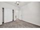 Bright bedroom with carpet flooring and double door closet at 22424 W La Pasada Blvd, Buckeye, AZ 85326