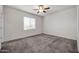 Small bedroom with carpet, ceiling fan and window blinds at 22424 W La Pasada Blvd, Buckeye, AZ 85326