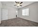 Second bedroom with carpet, ceiling fan and window blinds at 22424 W La Pasada Blvd, Buckeye, AZ 85326