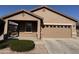 Single-story home with two-car garage and landscaped front yard at 22424 W La Pasada Blvd, Buckeye, AZ 85326