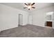 Main bedroom with carpet, ceiling fan and en-suite bathroom at 22424 W La Pasada Blvd, Buckeye, AZ 85326