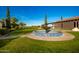 Courtyard view with a fountain and lush landscaping at 22808 N Los Gatos Dr, Sun City West, AZ 85375