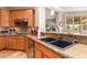 Modern kitchen with double sink, granite countertops, and ample cabinet space at 22808 N Los Gatos Dr, Sun City West, AZ 85375