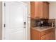 Kitchenette with coffee bar and built-in wine rack at 22808 N Los Gatos Dr, Sun City West, AZ 85375