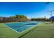 Well-maintained tennis court with ample space at 22808 N Los Gatos Dr, Sun City West, AZ 85375