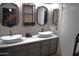 Double vanity bathroom with updated sinks and gray cabinets at 2315 W Union Hills Dr # 112, Phoenix, AZ 85027