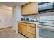 Kitchen features wood cabinets, white appliances, and ample counter space at 2315 W Union Hills Dr # 112, Phoenix, AZ 85027